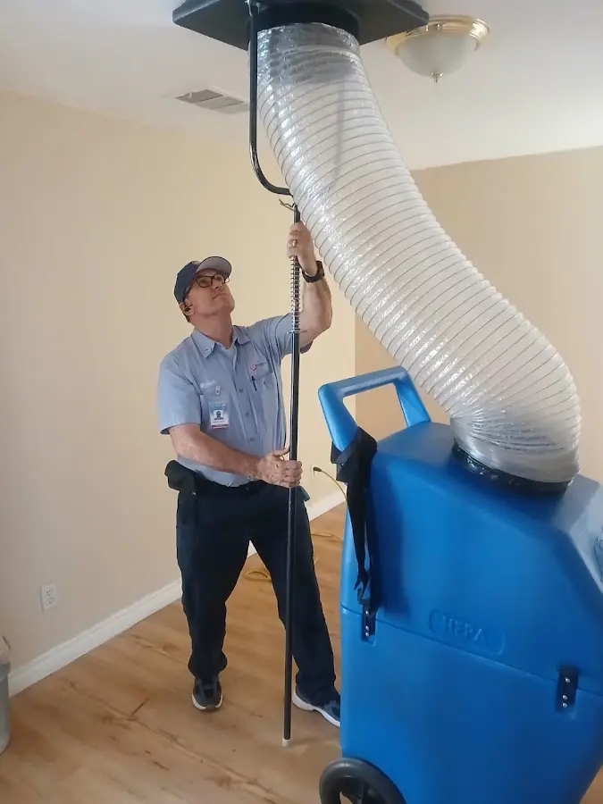 Furnace Tune-Up technician using HEPA equipment in Linganore